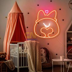 a baby's room with a neon sign that says hello kitty