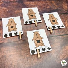 four brown bears cut out on clothes pins to make them look like they are playing cards