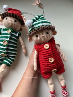 two crocheted dolls sitting next to each other