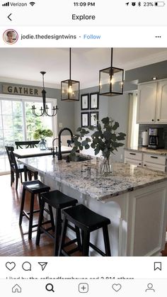 a kitchen island with stools in front of it and an instagram post on the bottom