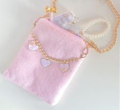 Our pink faux fur crossbody bag is the perfect size to hold a phone (All sizes), wallet, keys and or small essentials. Soft vegan fur. Features a removable gold chain link strap that contains 3 beautiful heart charms. Bag Measures: 7.5" H x 6" W x 1" D Strap Measures: 35" L Gold Crossbody Phone Bag For Gift, Gold Crossbody Phone Bag As Gift, Cute Gold Bags For Everyday Use, Cute Gold Bag, Fur Handbags, Pink Fur, Pink Faux Fur, Beautiful Handbags, Beautiful Heart