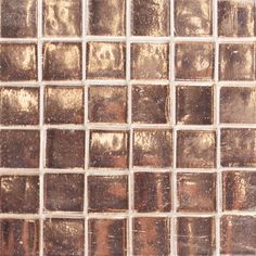 a close up view of some brown and white tiles