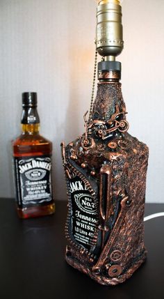 an old fashioned bottle lamp sitting on top of a table