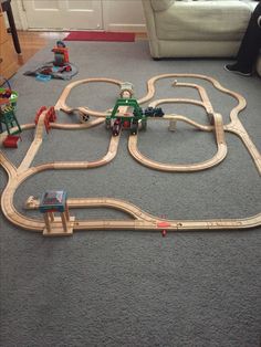 a toy train set is laying on the floor