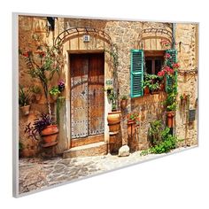 an old stone building with green shutters and potted plants on the outside wall