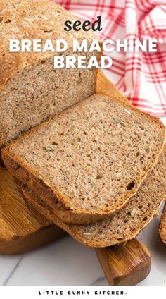 a loaf of bread sitting on top of a cutting board next to slices of bread