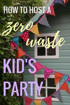 a kid's party with bunting and flags hanging from the side of a house