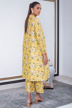 A breezy canary yellow silhouette is the perfect balance of print on print. Finished with a scallop lace detailing on the sleeves and a collared neckline, this raw silk co-ord set is your go to summer staple. Chic Summer Sets With Set-in Sleeves, Summer Floral Print Daywear Sets, Summer Silk Daywear Sets, Silk Summer Sets For Daywear, Summer Silk Sets For Daywear, Yellow Silk Set For Summer, Floral Print Sets For Spring Daywear, Silk Summer Sets With Printed Motifs, Yellow Silk Sets With Printed Motifs