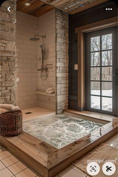 a bathroom with a jacuzzi tub next to a window