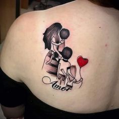 the back of a woman's shoulder with an image of two people holding balloons