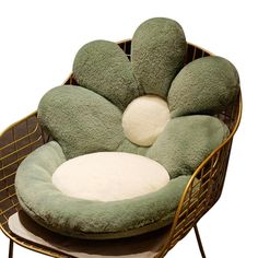 a dog bed that is shaped like a flower with two pillows on the top and bottom