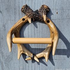 two deer antlers are hanging on the wall