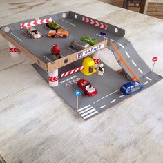 a table with cars and trucks on it