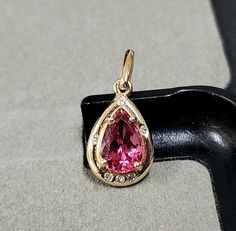 1. Pink Tourmaline 14k Gold Pendant 2. Made to Order 3. Gemstone - Natural Tourmaline with Diamond  4. Jewelry Type - Charms Pendant 5. Total Weight - 1.730 Gram Approx 6. Tourmaline Weight - 1.95 Carats 7. Gold Weight - 1.334 Grams Approx. 8. Gold Purity - 14k 9. Diamond - 0.03 Carats 10. Pendant Bails Size - 7 MM 11. Stone Shape - Teardrop 12. Women Pendant 13. Ready to dispatch in 1 - 2 days. 14. 14k marked 15. AAA Quality Pendant 16 1 Quantity Available 17. Best handmade Item 18. Outer Diame Tourmaline Gemstone Oval Pendant Jewelry, Unique Tourmaline Pendant Jewelry, Yellow Gold Tourmaline Pendant Necklace, Pink Tourmaline Necklace Gold, Pink Tourmaline Pendant, 11 Stone, Women Pendant, Pendant Bails, Pretty Pendant