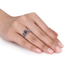 a woman's hand with a ring on it