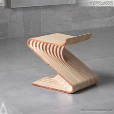 a wooden bench sitting on top of a cement floor