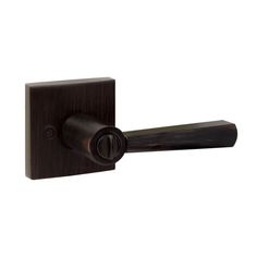 an image of a door handle on a wooden door knob with a black finish and dark wood grained finish