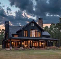 a large house sitting in the middle of a field