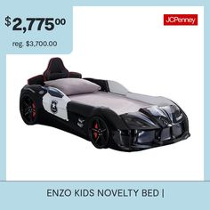 a black and white car bed with red wheels on it's headrests for $ 2, 775 00