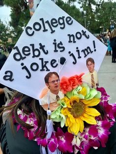 a person wearing a graduation cap with flowers in front of them that says college debt is not a joke i'm