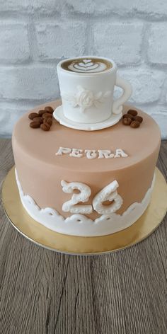 there is a cake that has coffee on it and the words peora written in white