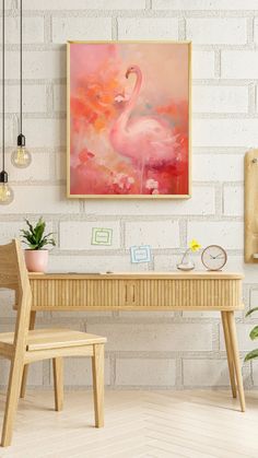 a pink flamingo painting hanging on a white brick wall next to a wooden chair