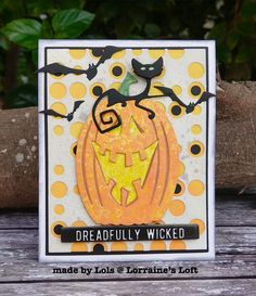 a card with a pumpkin and bats on it