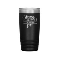 a black and silver tumbler cup with a fish on the side that says michael