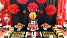 a basketball themed birthday party with red and black decorations, desserts, and snacks