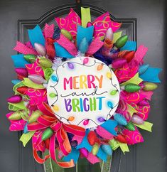 a merry and bright wreath on the front door