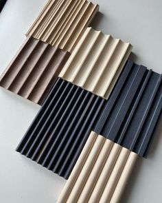 four different types of wood slats on a table