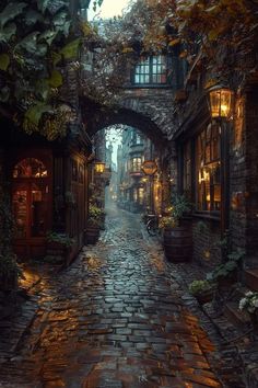 a cobblestone street in an old european city at night with lanterns on either side