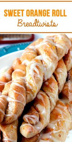 sweet orange roll breadsticks on a white plate