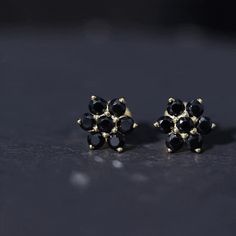 Product Details These lovely Floral Cluster Stud Earrings are designed with sparkling Round Cut Black Spinel over Solid Gold build to make for a charming accessory for your everyday looks. Product Information SKU SHP-EARRINGS042157281 Length 8.6 mm Width 7.5 mm Weight 1.76 gm (Approximate) BLACK SPINEL INFORMATION No.of Stones 14 Pieces Total Weight 1.26 Carat (Approximate) Dimension(approx) Round-3X3 mm-14 Pcs Color Black Cut Brilliant Shape Round Setting Type Prong-Setting Quality Grade AAA Vi Signature Jewelry, Black Spinel, Timeless Jewelry, Gold Design, Conflict Free Diamonds, Free Jewelry, Prong Setting, Round Cut, Solid Gold