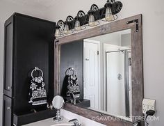 a bathroom with a sink, mirror and towel rack on the wall in front of it