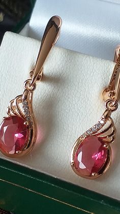 Vintage 1990-s 14 Ct Rolled Gold Ruby / Zircons Earrings- Hallmarked 585 RG The item is in excellent condition. The earrings probably were never used. Weight:- The item is approx. 3.61 grams. Hallmarks:- 585 RG for 14 CT rolled gold Ruby and Zircons stones are lab created. BOX IS NOT INCLUDED BUT WILL BE SHIPPED IN NICE VELVET POUCH BAG FREE WORLDWIDE SHIPPING WITH TRACKING NUMBER Velvet Pouch, Pouch Bag, Free Bag, Hallmark, Tracking Number, Jewelry Earrings Dangle, Dangle Drop Earrings, Ruby, Dangle Earrings