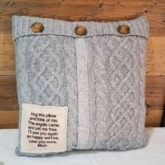 a pillow that has some buttons on the front and side of it, with a poem written