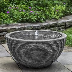 a stone bowl with water coming out of it