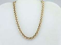 A simple chain, worn without pendant or distraction, is the ultimate luxury statement piece! We love the bold profile of this necklace, and the elegant sheen of the polished gold. Sophisticated and refined, this will transition from casual daytime wear to the finest of evening gowns with ease! Metal: 14K Yellow Gold Width of Chain: 7 mm Length of Chain: 16 Inches Marks: "14KT" Stamped on the clasp Luxury Modern Jewelry With Wheat Chain, Luxury Gold Plated Wheat Chain Jewelry, Modern Luxury Jewelry With Wheat Chain, Luxury Chain Necklace For Evening, Luxury Everyday Wheat Chain Necklace, Luxury Metal Jewelry With Wheat Chain, Luxury Elegant Wheat Chain Jewelry, Luxury Gold Plated Wheat Chain Necklaces, Luxury Metal Wheat Chain Necklace