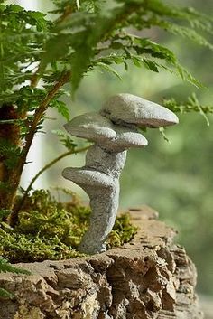 rocks stacked on top of each other near a tree