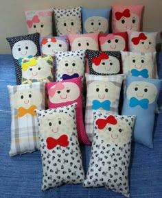 many pillows with different designs on them