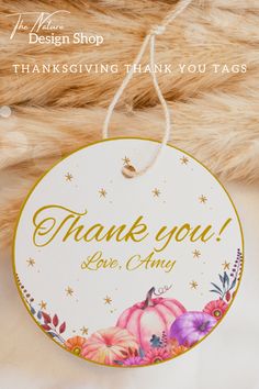 a thank you tag hanging from a teddy bear