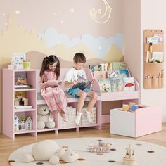 two children sitting on a pink bench in a play room with toys and bookshelves