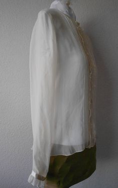 "Beautiful 100% sheer silk blouse Long sleeve Ruffled front and sleeves Expressive six front lines on both sides Satin accentuated along neckline, center and sleeve ends Great condition with no stains or rips Dimensions Shoulder 15\" Bust 39\" Sleeve 24\" Length 24\"" Cotton Lace Tops, Sheer Jacket, Sheer White Blouse, Fashion Network, Blouse Silk, Ivory Sweater, Ivory Silk, Different Dresses, Hand Knitted Sweaters