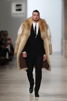 Model walks for Nuno Gama...so casually that you wonder whether he's aware of his great fur. Coat Men, Mens Fashion Suits, Gentleman Style