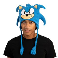 Embrace the world of Sonic the Hedgehog with this officially licensed Sonic Cosplay Laplander Beanie. Designed for fans of all ages, this beanie captures the spirit of Sonic's character with a big face design that includes 3D quills crafted from cut fabric and flat embroidery. Whether you're a dedicated cosplayer or simply want to showcase your Sonic fandom, this beanie is the perfect accessory. Made from high-quality acrylic yarn, it provides both warmth and comfort, making it suitable for cold Novelty Beanie For Cosplay, Blue Novelty Costume Accessories For Cosplay, Novelty Beanie Hat For Cosplay, Sonic Cosplay, Big Face, Face Design, The Hedgehog, Acrylic Yarn, Stay Warm