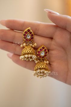 Add some sparkle to your outfit with our temple earrings! These unique earrings feature kundan encrusted gems, attached to an embossed jhumka and highlighted with elegant pearls. Perfect for any occasion, these earrings are sure to make a statement and elevate your style game! Closure - Push Back Weight - 21gm (pair) Luxury Temple Jewelry Chandbalis For Party, Luxury Kundan Fusion Earrings, Affordable Temple Jewelry For Diwali, Luxury Fusion Kundan Earrings, Temple Work, Temple Earrings, Work Earrings, Earrings Kundan, Jhumka Earrings