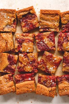 square pieces of cake sitting on top of a table