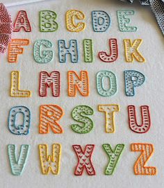 the letters are made out of fabric and have different colors