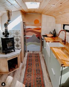 a kitchen area with wooden counter tops and an oven in the back ground next to a sink